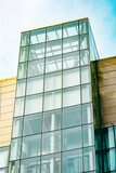 Fototapeta Do przedpokoju - Skyscrapper with abstract windows. Modern architecture facade