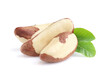 Brazil nuts with leaves on white background