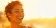 © mariiaplo - Joyful Woman Smiling in Golden Sunset Light