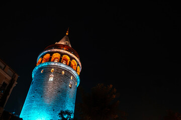 Wall Mural - View of Galata Tower illuminated with lights at night in Istanbul, Turkey.