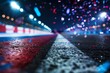 Race track at night with motion blur and confetti