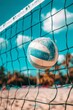 Beach volleyball ball and net under blue sky   summer sea leisure and beach games concept