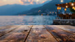 Product display template montage wooden table top with blurred background of evening mountain lake and restaurant in the distance