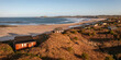 © teamjackson - Aerial view of remote beach huts on the Northumberland coast at Embleton Bay