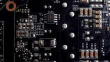 A Close-up Of The Rear Side Of A Graphics Card Reveals The PCB, A Slender Platform Accommodating Various Chips And Electronic Elements. Connector Interface.