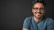 © GraphixOne - A Handsome hispanic man wearing casual t shirt and glasses happy face smiling with crossed arms looking at the camera, positive person