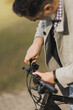 Man Checking the Handlebars of His Bicycle Before Riding