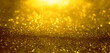 Abstract background of gold glitter lights. De-focused background