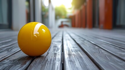 Wall Mural - A yellow object sitting on a wooden deck outside, AI