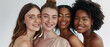 © Synthetica - Diverse women group, different multiethnic girls models standing together on background looking at camera advertising beauty cosmetic skin care products. Aesthetic portrait.