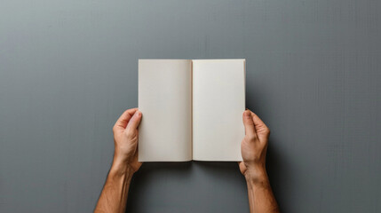 Hands of person holding blank white empty paper mock up. Man or woman presenting mockup paper page sheet, book or letter, card for advertising copy space concept. Close up view.