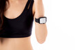Close-up of a fitness tracker smartwatch on the wrist of a young asian woman wearing a sportswear, isolated white background, fitness tracker on hand woman's wrist, sport concept.