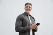 © Stock 4 You - Portrait of smiling dreaming hispanic business man using smartphone mobile phone device for online financial bank transactions. 40s freelancer entrepreneur holding cellphone isolated, white background