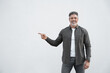 © Stock 4 You - Smiling mature 40s old grey haired businessman in casual clothes, pointing hand finger at copy space for ad promo advertising. Businessman standing happy isolated on white background, looking camera