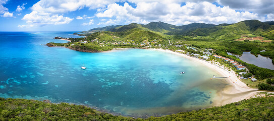 Wall Mural - panoramic aerial view of carlisle bay with lush rain forest and turquoise and emerald sea, antigua a