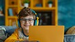 A cheerful young child with curly hair engaging with a bright yellow laptop, symbolizing the joy of learning and technology