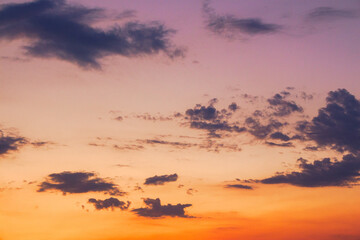 Wall Mural - dark cumulus clouds on a purple sky sky. beautiful nature background in evening light