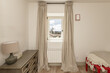 © Toyakisfoto.photos - Bedroom with single beds, wooden dresser and window with beautiful views