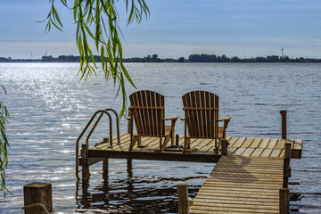 Wall Mural - Rondeau Provincial Park lake Erie bay pier with muskoka chairs, Ontario, Canada