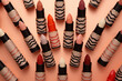 Collection of different colored lipsticks Decorative cosmetics  sponges Cosmetics Makeup Products  Concept