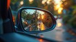 © Elchin Abilov - The side rear-view mirror mounted on a car.