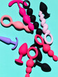 Set of sex toys. anal plugs and dildo over blue backdrop