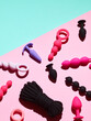 Sex toys background. anal plugs and dildo over pink backdrop