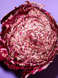 Cut of red cabbage over violet background