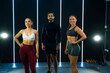 Hispanic fitness instructors ready for class in a modern gym