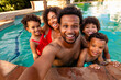 © McKinsey Jordan/Stocksy - Dad Takes Selfie Of Family In Pool