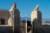 Fototapeta  - Lions looking at San Fernando's Castle (Castell de Sant Ferran) creating impregnable defensive walls (fortresses). In the background, the mountains surrounding the city of Alicante (Costa Blanca),
