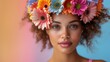 A playful portrait of a model with bright, multi-colored gerbera daisies instead of hair. 