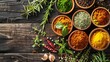 Various colorful herbs and spices arranged on a wooden table, adding vibrancy to culinary preparations.