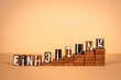 Compliance word in German. Wooden alphabet letters on a light background