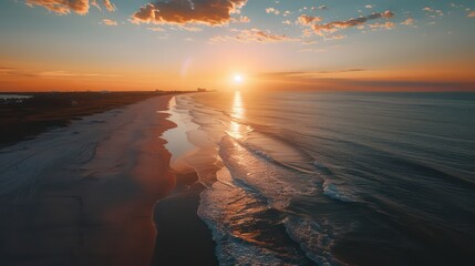 Wall Mural - wide beach landscape view from sideways with a gorgeous sunset