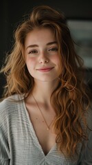 Wall Mural - portrait of young happy woman looks in camera