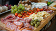 Wooden boards cold meat various cheeses fruit