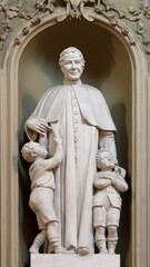 Wall Mural - VICENZA, ITALY - NOVEMBER 6, 2023: The carved statue of St. Don Bosco in the church Chiesa di San Gaetano by  Orazio A. Marzari (1999).