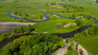 Curvy Nida river bends in Swietokrzyskie,Ponidzie region in Poland. Aerial Drone View