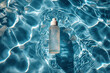 Yellow tube of sunscreen in swimming pool. Skin care and protection concept.