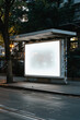 A blank white horizontal billboard on the side of an urban bus stop, illuminated by natural daylight, provides space for advertising or promotional content.