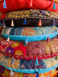 Colorful stack of ornate embroidered Moroccan floor cushions