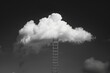 Black and white photo of a ladder leading to a cloud. Suitable for concepts of ambition and reaching for the sky