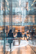 © Starmarpro - Corporate office, workplace. People moving in the blurry motion behind the glass. High quality photo
