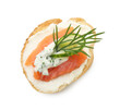 Tasty canape with salmon, cucumber, cream cheese and dill isolated on white, top view
