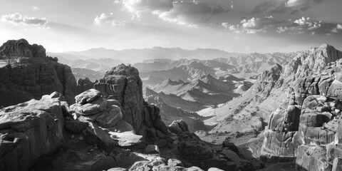 Poster - A stunning black and white photo of a majestic mountain range. Perfect for travel websites or nature blogs