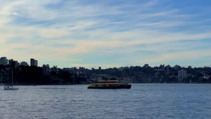 Wall Mural - Sydney Harbour forshore viewed from the Gardens in NSW Australia on a nice sunny and partly cloudy afternoon blue skies