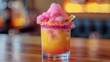 A playful mocktail featuring a cotton candy rim paired with a sharp and tangy aged cheddar.