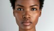 © IgnacioJulian - close-up portrait of a beautiful african american woman on white background