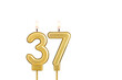 Golden number 37 birthday candle on white background